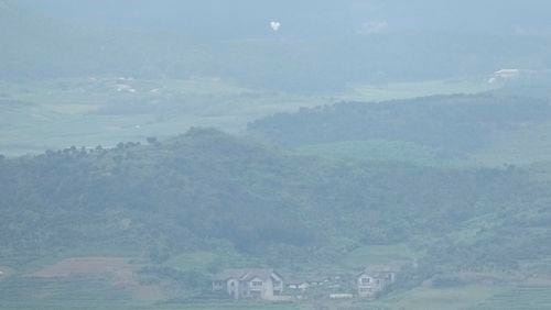 Balloons are seen from the Unification Observation Post in Paju, South Korea, near the border with North Korea, Thursday, Sept. 5, 2024. (AP Photo/Lee Jin-man)