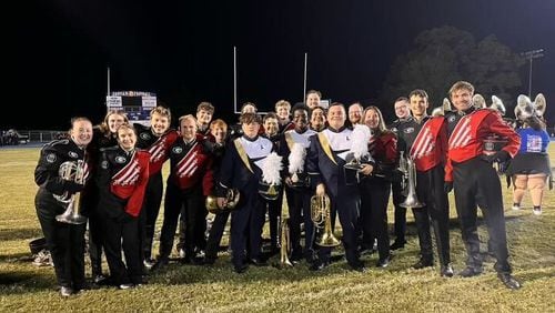 Baritone horn players from Apalachee High School marching band and University of Georgia Redcoats gathered together to share traditions, a dance circle and advice.