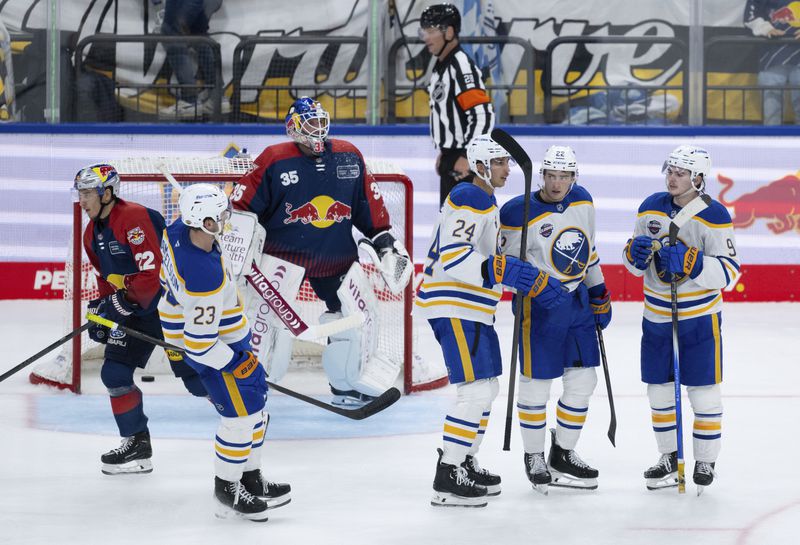 Buffalo Sabres NHL hockey players celebrate a goal during an ice hockey match against Red Bull Munich in Munich, Germany, Friday, Sept. 27, 2024.(Sven Hoppe/dpa via AP)