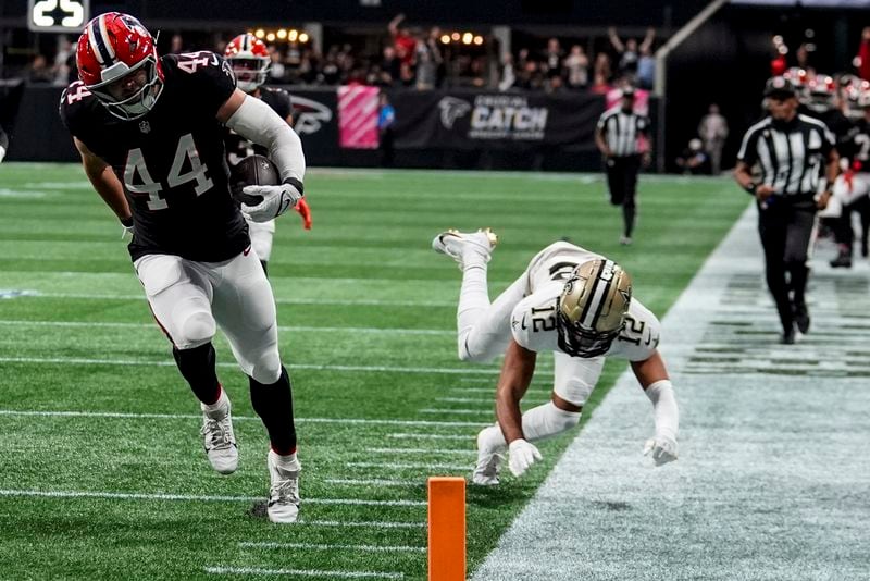 Atlanta Falcons linebacker Troy Andersen (44) runs into the end zone on an interception against the New Orleans Saints during the first half of an NFL football game, Sunday, Sept. 29, 2024, in Atlanta. (AP Photo/John Bazemore)