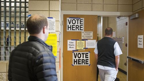 Voters file into the gymnasium at the Smyrna Community Center this month to cast their ballots. (Alyssa Pointer/Atlanta Journal Constitution)