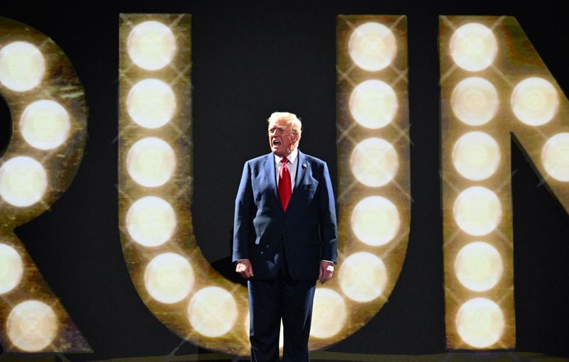 Former president Donald Trump walks onto the stage on the final day of the Republican National Convention in Milwaukee.