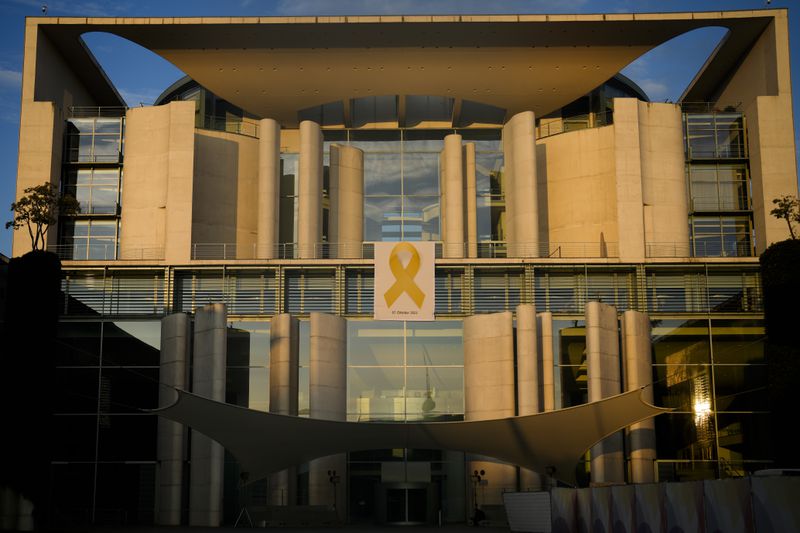 A Yellow Ribbon displayed as the facade of the German Chancellor to show solidarity with Israel marking the first anniversary of the Hamas spearheaded attacks on Israel, in Berlin, Germany, Monday, Oct. 7, 2024. (AP Photo/Markus Schreiber)