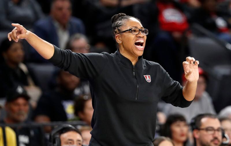 Atlanta Dream head coach Tanisha Wright calls to players during the first half of a WNBA basketball game against the Las Vegas Aces, Friday, Aug. 30, 2024, in Las Vegas. (Steve Marcus/Las Vegas Sun via AP)