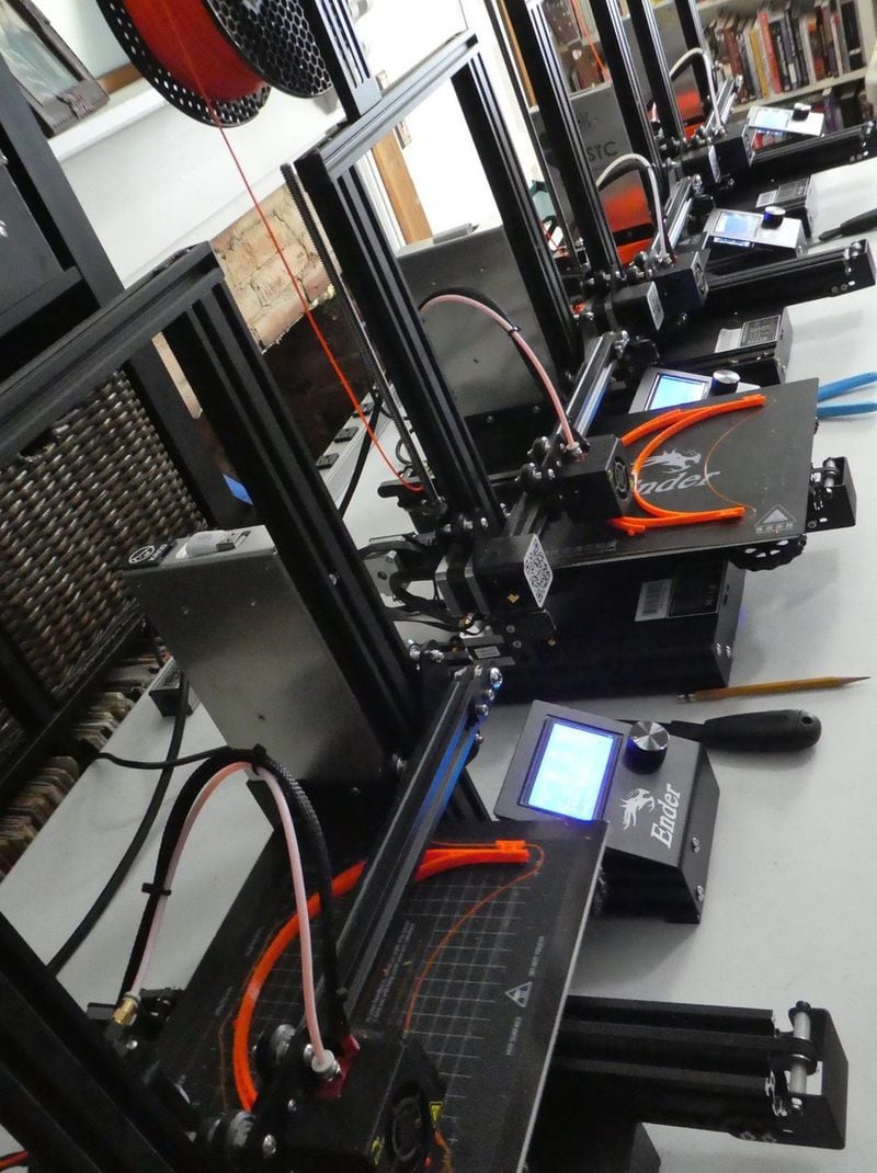 A line of 3D printers at work in the Sugiuchi home. Contributed by Deirdre Sugiuchi