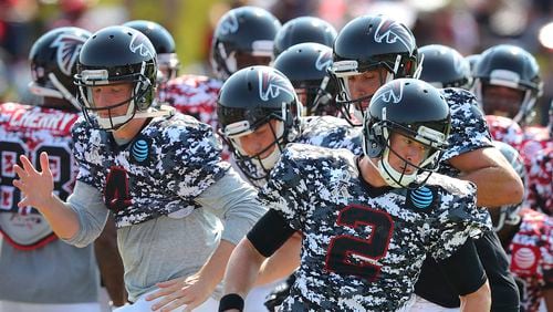 Then-Falcons quarterback Matt Ryan leads the team through an agility drill during Military Day in August 2017 at the team's football practice facility in Flowery Branch. (Curtis Compton/Atlanta Journal-Constitution via AP)