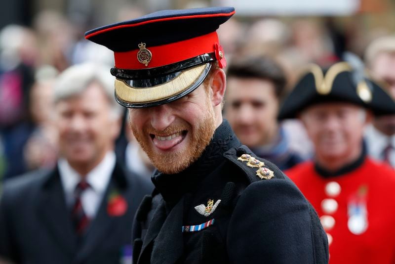 FILE - Britain's Prince Harry smiles as he speaks to veterans as he attends the official opening ceremony of The Field of Remembrance at Westminster Abbey in London, Thursday, Nov. 9, 2017. (AP Photo/Kirsty Wigglesworth, File)