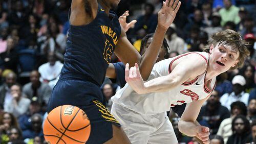 Cherokee's Cameron Pope (1) gets off a pass around Wheeler's Cameron Brown (13) during 2023 GHSA Basketball Class 7A Boy’s State Championship game at the Macon Centreplex, Saturday, March 11, 2023, in Macon, GA. (Hyosub Shin / Hyosub.Shin@ajc.com)