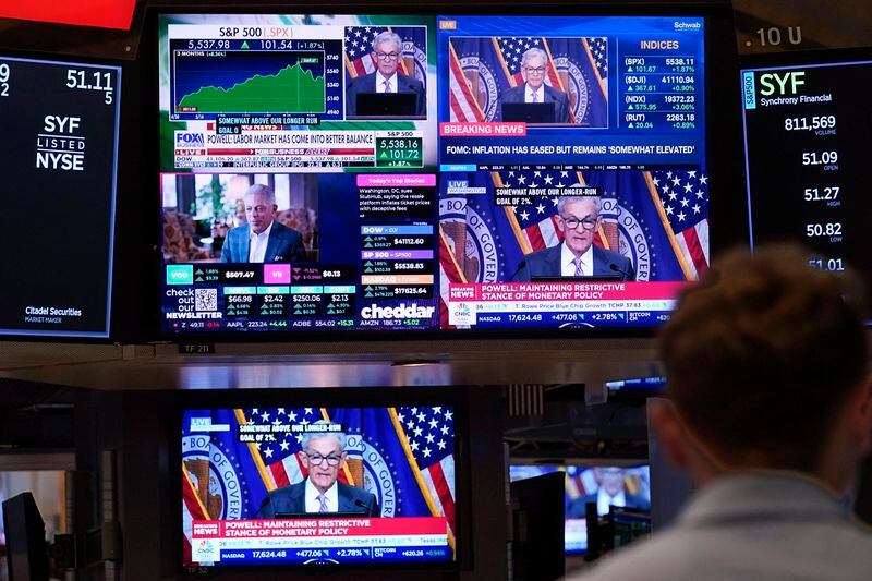 FILE - A bank of television screens on the floor of the New York Stock Exchange, shows Federal Reserve Chairman Jerome Powell, July 31, 2024. (AP Photo/Richard Drew., File)