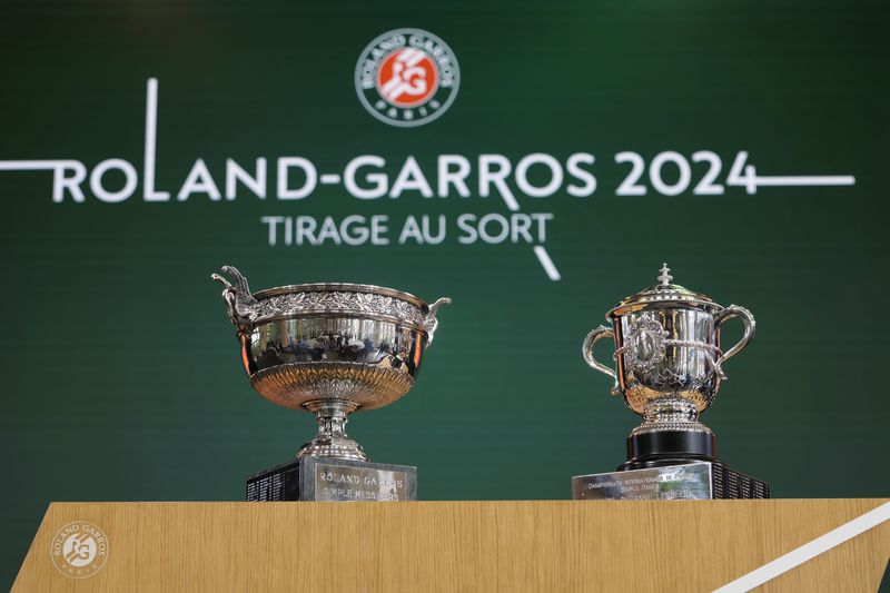 The Men's trophy, left, and the Women's trophy are presented during the draw for the French Tennis Open at the Roland Garros stadium, Thursday, May 23, 2024 in Paris. The tournament starts Sunday. (AP Photo/Thibault Camus)