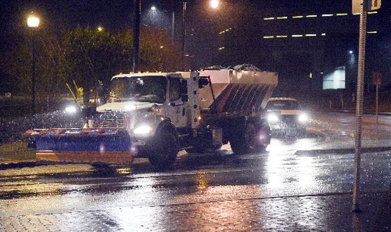 DeKalb County public works plows and spreader trucks head to their deployment areas on Friday in anticipation of snow and icy conditions expected to hit later in the day. Forecasts have some metro areas getting up to 5 -inches of snow overnight. KENT D. JOHNSON/ KDJOHNSON@AJC.COM