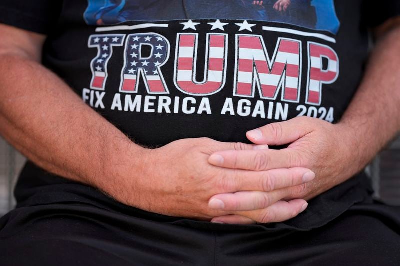 Joseph Wiederien wears a Republican presidential nominee former President Donald Trump t-shirt as he speaks during an interview with The Associated Press, Friday, Sept. 6, 2024, in Des Moines, Iowa. (AP Photo/Charlie Neibergall)