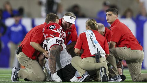 Georgia head coach Kirby Smart and the training staff tend to Georgia offensive lineman Tate Ratledge (69) after he got injured during the first half against Kentucky at Kroger Field, Saturday, Sept. 14, 2024, in Lexington, Kentucky. (Jason Getz / AJC)

