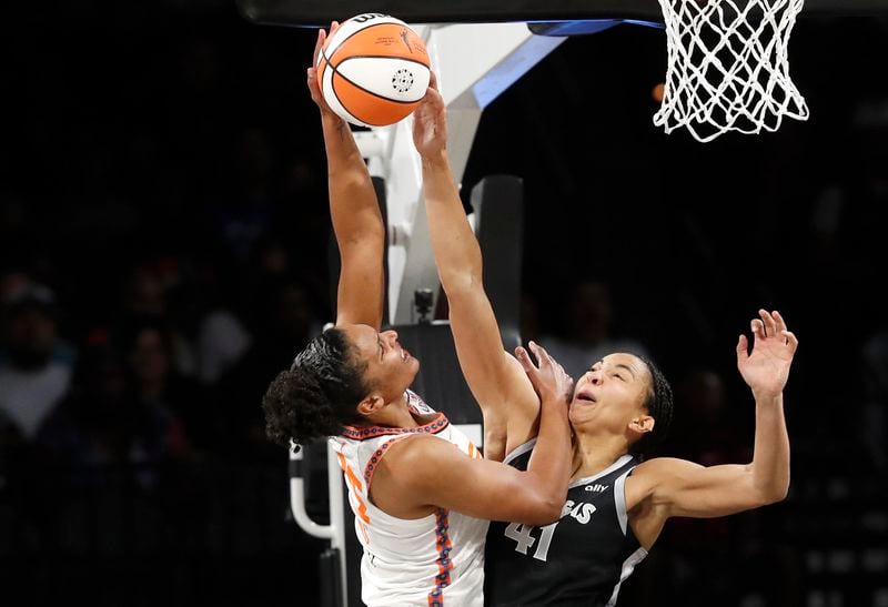 Connecticut Sun forward Alyssa Thomas (25) shoots against Las Vegas Aces center Kiah Stokes (41) during the first half of a WNBA basketball game Sunday, Sept. 15, 2024, in Las Vegas. (Steve Marcus/Las Vegas Sun via AP)