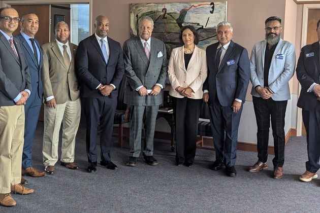 From left to right: Georgia Indo-American Chamber of Commerce (GIACC) board members Amber Mehta and SK Raj; College Park Councilmember Joe Carn; Development Authority of Fulton County Chair Kwanza Hall; Fulton County Commission Chair Robb Pitts; GIACC Chair Grace Multani; GIACC President Jay Joshi; GIACC board member Nick Patel and GIACC secretary Daniel Preston outside of Pitts' office on Thursday, September 19, 2024. Pitts is part of a delegation of Fulton County officials traveling to India in October.