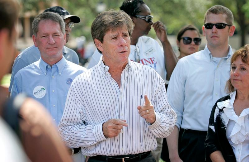 FILE - Candidate Rod Smith, center, announces his acceptance to run for lieutenant governor Saturday, Aug. 21, 2010, during a news conference at the Bo Diddley Downtown Community Plaza in Gainesville, Fla. (AP Photo/The Gainesville Sun, Aaron Daye, File)