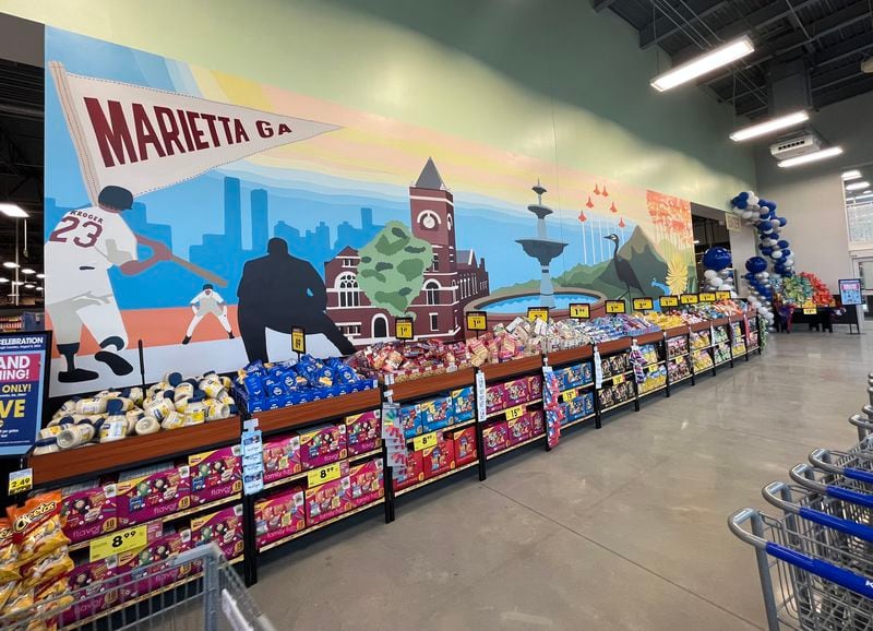This mural inside the new Kroger store in Marietta depicts Cobb County imagery including the courthouse, the Marietta Square fountain, baseball players and the Atlanta skyline in the background, as seen on Thursday, August 3, 2023. (Taylor Croft/taylor.croft@ajc.com)