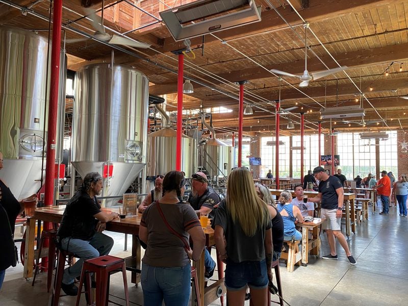 The taproom at Liquid Nation Brewing is kid and dog friendly and features cornhole tournaments, card and board games, and food trucks.
(Bob Townsend for the Atlanta Journal Constitution)