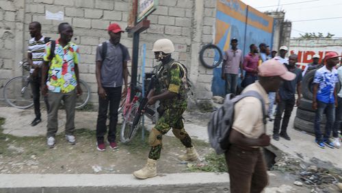 A Kenyan police officer patros an area near the international airport in Port-au-Prince, Haiti, Wednesday, July 3, 2024. (AP Photo/Odelyn Joseph)