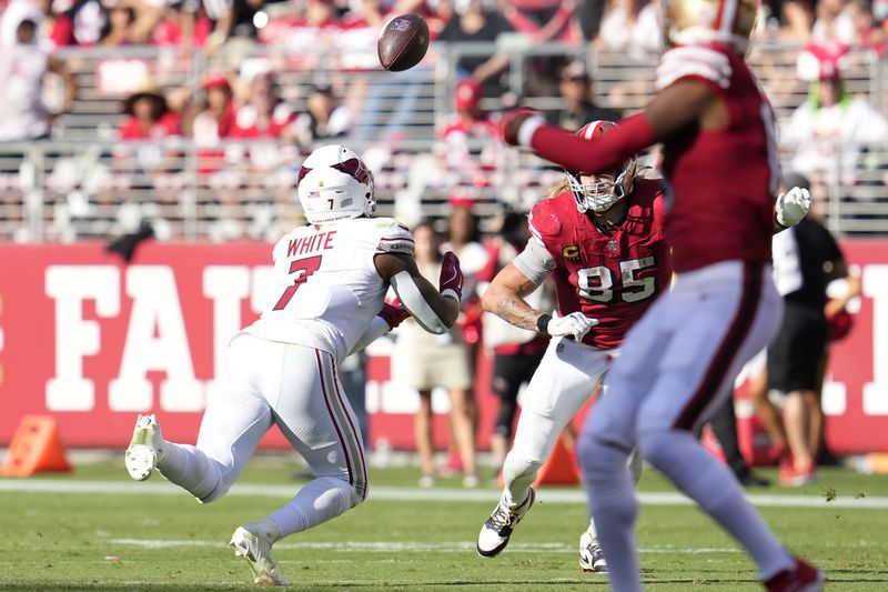 Arizona Cardinals linebacker Kyzir White (7) intercepts a pass in front of San Francisco 49ers tight end George Kittle (85) during the second half of an NFL football game in Santa Clara, Calif., Sunday, Oct. 6, 2024. (AP Photo/Godofredo A. Vásquez)