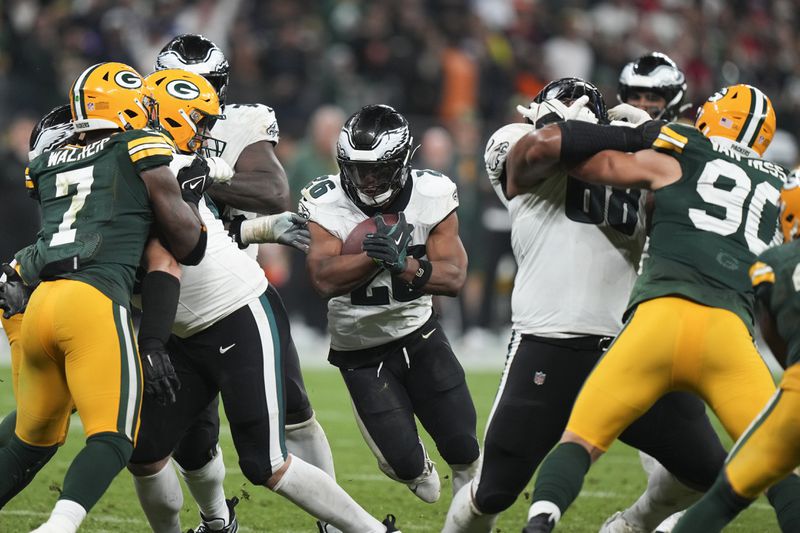 Philadelphia Eagles running back Saquon Barkley (26) runs for a touchdown against the Green Bay Packers during the second half of an NFL football game, Friday, Sept. 6, 2024, at the Neo Quimica Arena in Sao Paulo. (AP Photo/Fernando Llano)