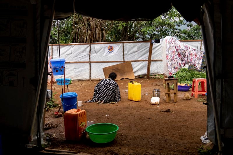 A sex worker suffering from mpox sits in a hospital courtyard Wednesday, Sept. 4, 2024 in Kamituga, eastern Congo. (AP Photo/Moses Sawasawa)