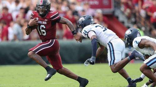 South Carolina quarterback LaNorris Sellers (16) runs away from Old Dominion linebacker Jahleel Culbreath (34) during the first half of an NCAA college football game Saturday, Aug. 31, 2024, in Columbia, S.C. (AP Photo/Artie Walker Jr.)