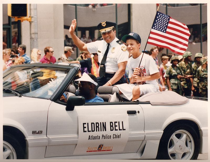 Eldrin Bell, former police chief of Atlanta,  with his son,Justin Guarini, who was the runner-up on the first season of  "American Idol," at a Fourth of July parade in the early 1990s. (Photo courtesy of Eldrin Bell.)