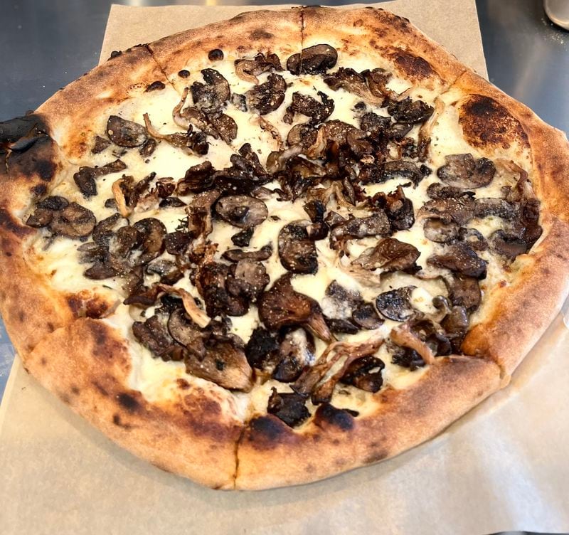 The Georgia Mushrooms pizza from Minnie Olivia in Alpharetta is loaded with local fungi and rounded out with taleggio and mozzarella cheeses. Courtesy of Minnie Olivia