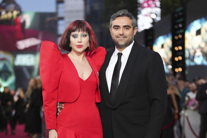 Lady Gaga, left, and Michael Polansky pose for photographers upon arrival at the premiere for the film 'Joker: Folie A Deux' on Wednesday, Sept. 25, 2024, in London. (Photo by Scott A Garfitt/Invision/AP)