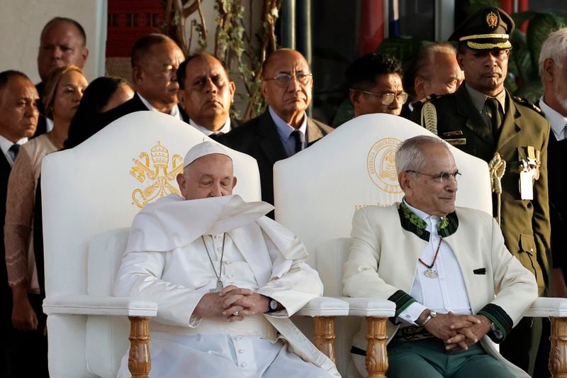 Pope Francis and East Timor's President Jose Ramos-Horta, right, arrive for a welcoming ceremony at the Presidential Palace in Dili, East Timor, Monday Sept. 9, 2024. (Yasuyoshi Chiba/Pool Photo via AP)