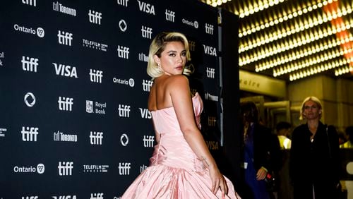 Florence Pugh arrives on the red carpet for the film "We Live in Time" during the Toronto International Film Festival in Toronto on Friday, Sept. 6, 2024. (Christopher Katsarov/The Canadian Press via AP)