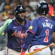 Atlanta Braves’ Michael Harris is greeted by Ozzie Albies (1) after a 2-RBI home run against the San Diego Padres during the eighth inning of National League Division Series Wild Card Game Two at Petco Park in San Diego on Wednesday, Oct. 2, 2024.   (Jason Getz / Jason.Getz@ajc.com)