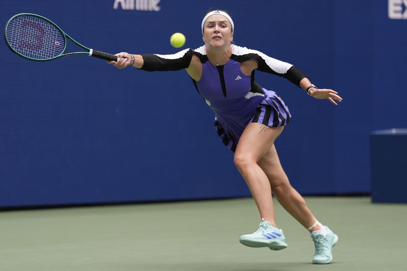 Elina Svitolina, of Ukraine, returns a shot to Coco Gauff, of the United States, during the third round of the U.S. Open tennis championships, Friday, Aug. 30, 2024, in New York. (AP Photo/Seth Wenig)