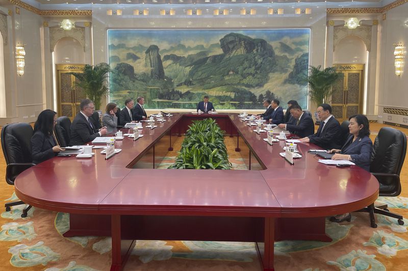 White House national security adviser Jake Sullivan, rear left, accompanied by U.S. Ambassador to China Nicholas Burns meets Chinese President Xi Jinping, center, accompanied by China's Foreign Minister Wang Yi at the Great Hall of the People in Beijing, China Thursday, Aug. 29, 2024. (Trevor Hunnicutt/Pool Photo via AP)