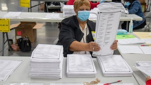 Election workers in DeKalb County, Georgia, sort presidential ballots on Nov. 14, 2020. (Steve Schaefer/Atlanta Journal-Constitution)