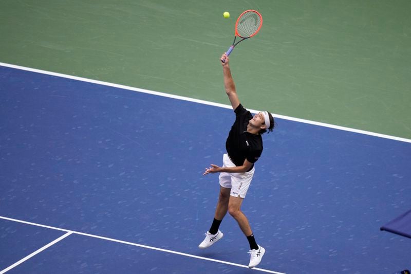 Taylor Fritz, of the United States, returns a shot to Jannik Sinner, of Italy, during the men's singles final of the U.S. Open tennis championships, Sunday, Sept. 8, in New York. 2024. (AP Photo/Frank Franklin II)