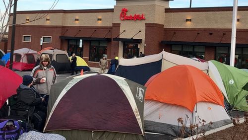 Customers, like the people in this file photo, can camp out for a chance at free Chick-fil-A for a year at a new Braselton location.