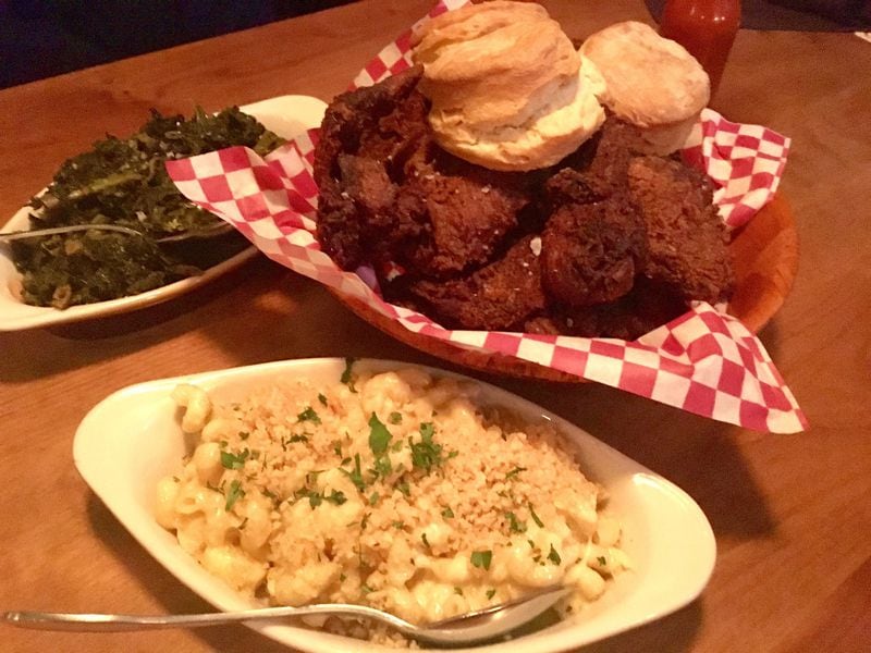 Wednesday is fried-chicken night at LLoyd’s Restaurant and Lounge in Inman Park. The once-a-week special comes with biscuits and two sides (shown here with braised greens and macaroni and cheese). CONTRIBUTED BY ROBERT WILLIAM LAND