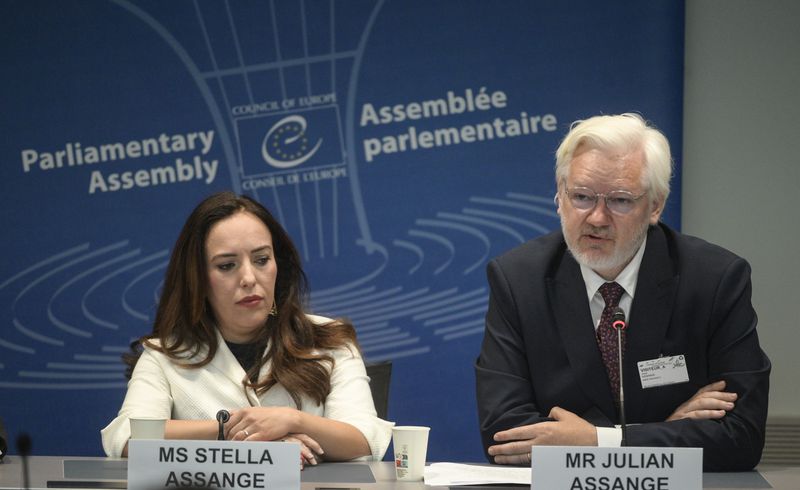 Wikileaks founder Julian Assange, right, assesses the Council of Europe while his wife Stella Assange sits next to him, in Strasbourg, eastern France, Tuesday, Oct. 1, 2024. (AP Photo/Pascal Bastien)