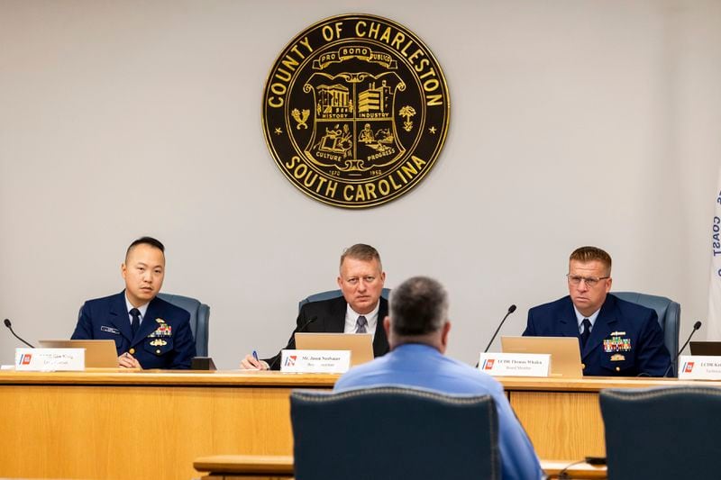 Jason Neubauer, seated in middle, board chairman, questions Matthew McCoy, a former OceanGate employee, during the final day of the Coast Guard investigatory hearing on the causes of the implosion of an experimental submersible headed for the wreck of the Titanic, Friday, Sept. 27, 2024, in North Charleston, S.C. (AP Photo/Mic Smith)