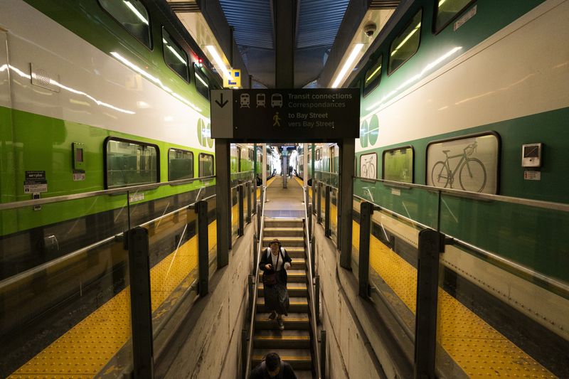 Commuters arrive at Union Station on a GO Train as a national rail shutdown causes delays in Toronto, Thursday, Aug. 22, 2024. (Paige Taylor White /The Canadian Press via AP)