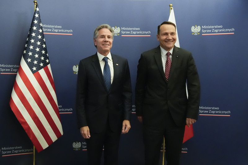 U.S. Secretary of State Antony Blinken, left, welcomes by Polish Foreign Minister Radosław Sikorski, right, for talks in Warsaw, Poland, Thursday, Sept. 12, 2024. (AP Photo/Mark Schiefelbein, Pool)