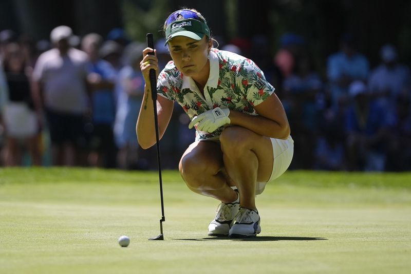 Lexi Thompson lines up her shot on the third green during the second round of the Women's PGA Championship golf tournament at Sahalee Country Club, Friday, June 21, 2024, in Sammamish, Wash. (AP Photo/Gerald Herbert)