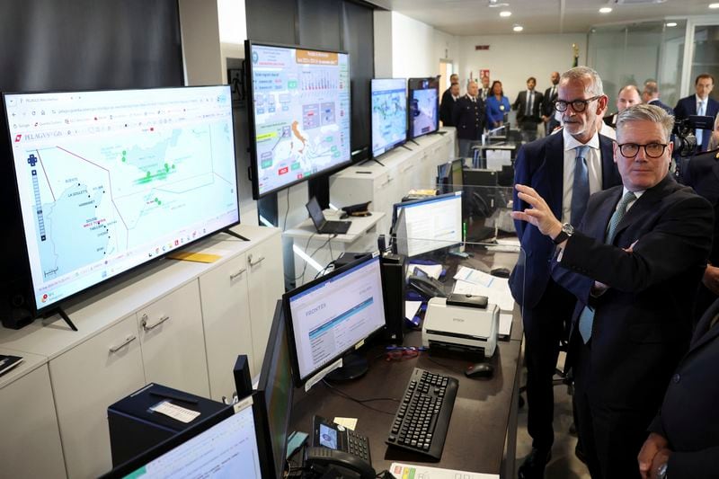 British Prime Minister Keir Starmer, right, visits Italy’s national immigration crime coordination center, on the occasion of his visit to Rome, Monday, Sept. 16, 2024. (Phil Noble/Pool Photo via AP)