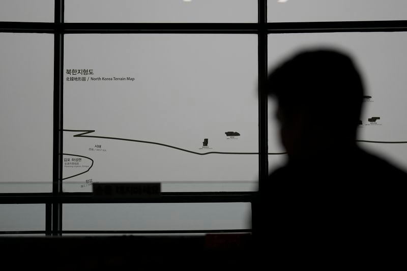 A visitor stands near a map of North Korea, in Paju, South Korea, Thursday, Sept. 5, 2024. (AP Photo/Lee Jin-man)