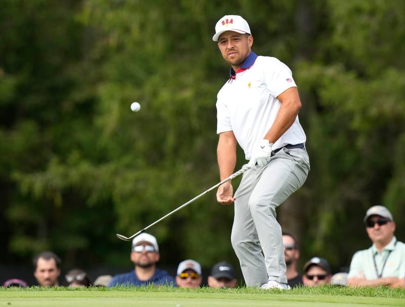 United States team member Xander Schauffele chips onto the second green during the second round of the Presidents Cup golf tournament at Royal Montreal Golf Club in Montreal, Friday, Sept. 27, 2024. (Frank Gunn/The Canadian Press via AP)