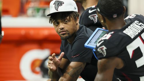 Atlanta Falcons cornerback A.J. Terrell (24) talks with cornerback Natrone Brooks (35) on the bench during the second half of their preseason NFL game against the Jacksonville Jaguars at Mercedes-Benz Stadium, on Friday, Aug. 23, 2024, in Atlanta. The Falcons lost 31-0. (Jason Getz / AJC)
