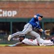 Atlanta Braves' Michael Harris II, bottom, slides successfully into second before Kansas City Royals second baseman Michael Massey, top, can catch the ball in the first inning of a baseball game, Sunday, Sept. 29, 2024, in Atlanta. (AP Photo/Jason Allen)