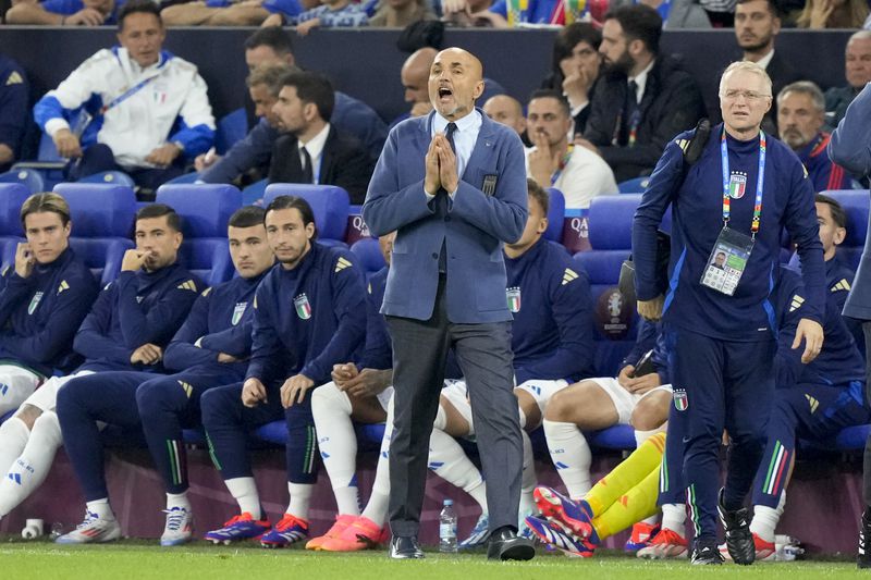 Italy coach Luciano Spalletti yells from the bench during a Group B match between Spain and Italy at the Euro 2024 soccer tournament in Gelsenkirchen, Germany, Thursday, June 20, 2024. (AP Photo/Martin Meissner)